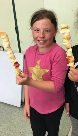 Playscheme children with their fruit kebab creations