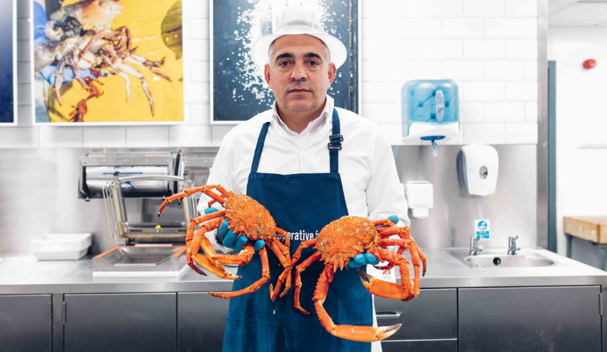 Carlos holding two crabs