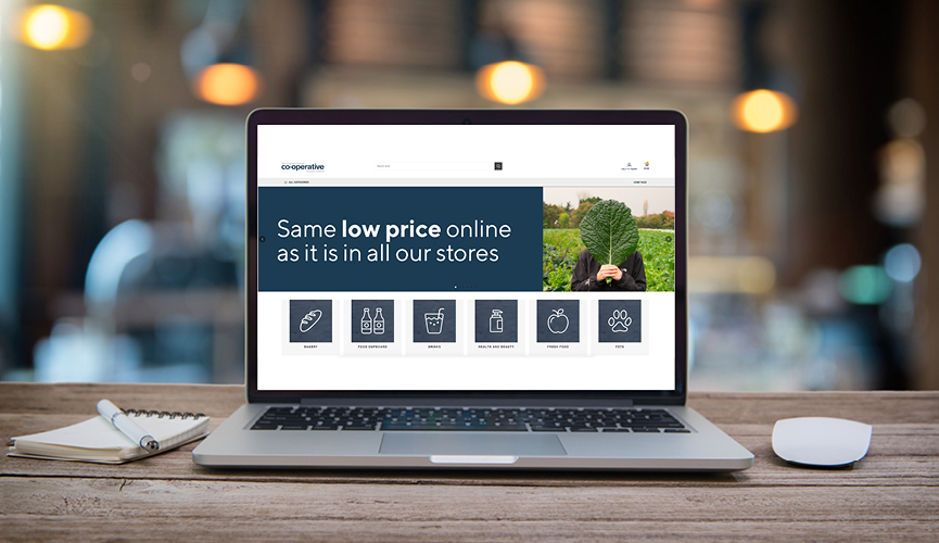 Laptop open with online groceries website on screen