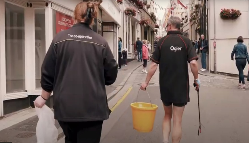 Following two people picking up litter in St Peter Port