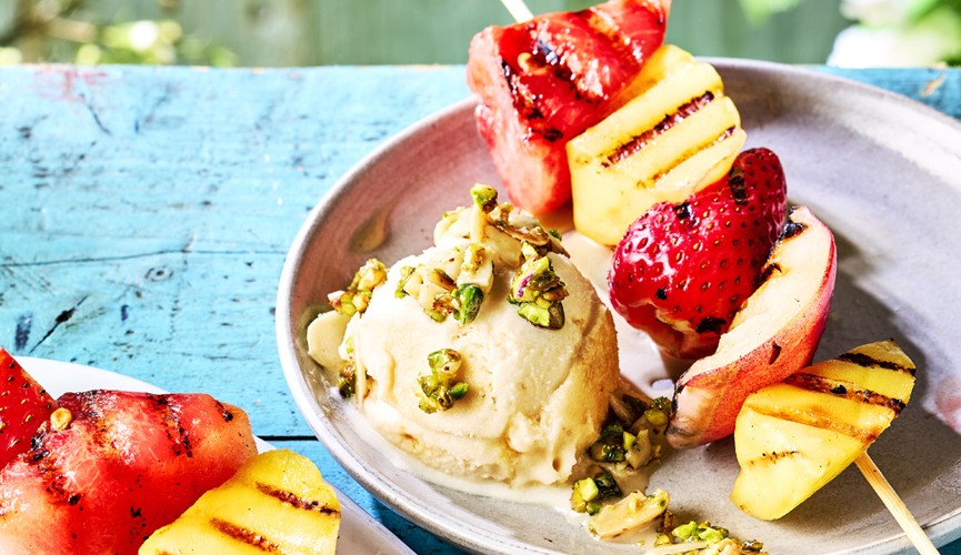 Fruit kebabs with vegan ice cream & chopped nuts